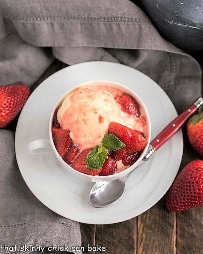 Cheesecake Ice Cream with Strawberry Sauce in a teacup viewed from above