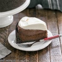 Slice of Mississippi Mud Pie on a white plate with a red handle fork
