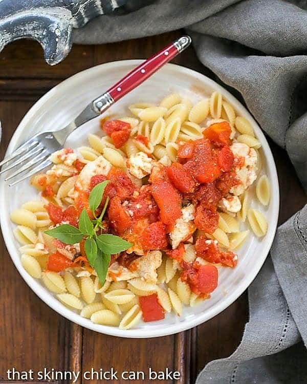 Chicken Feta Casserole from above on a white plate with a red handled fork.