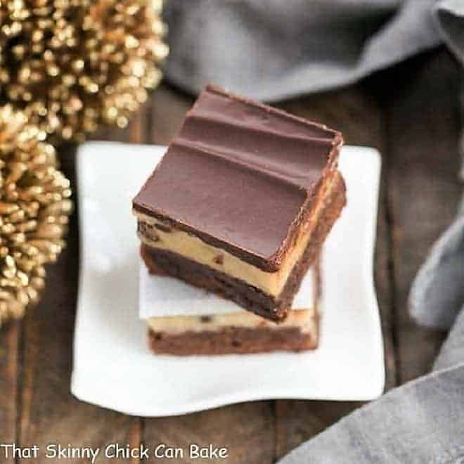 Chocolate Chip Cookie Dough Brownies stacked on a small white plate.