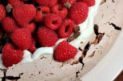 Chocolate Raspberry Pavlova - A sublime dessert with a chocolate meringue topped with berries and cream Chocolate Raspberry Pavlova photo from 2011