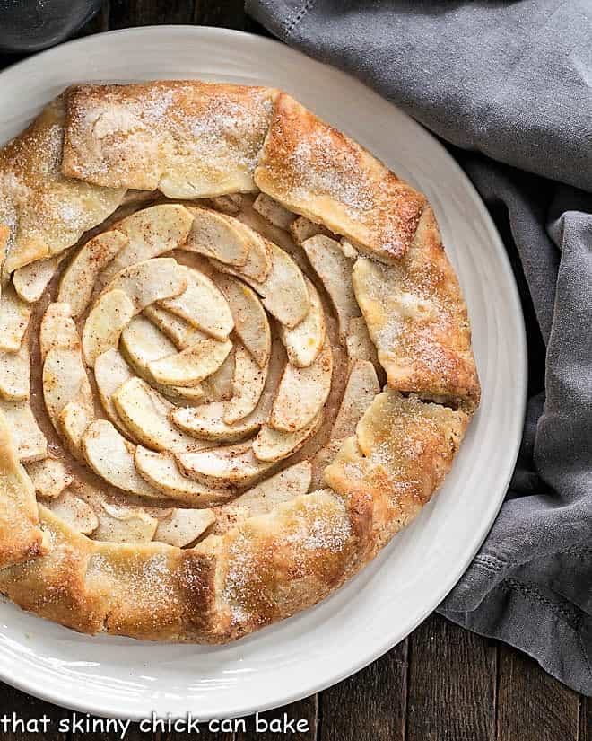 Partial view of Apple Tart from above on a white serving plate.