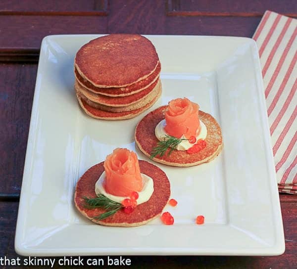 Buckwheat Blini with Smoked Salmon Roses on a white platter