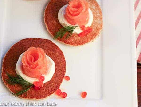 Overhead view of 2 Buckwheat Blini with Smoked Salmon Roses