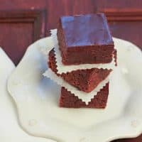 Stack of truffle brownies on a geometric white plate