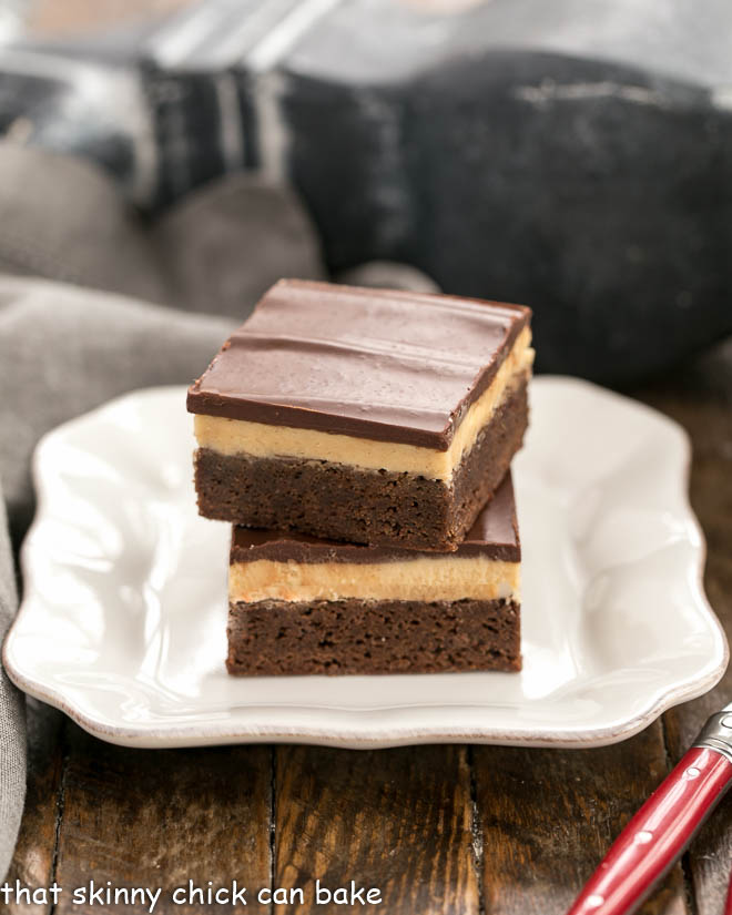 Peanut Butter Truffle Brownies stacked on a square white plate