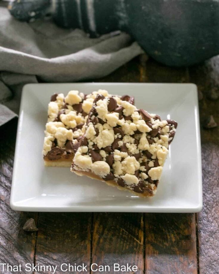 2 Caramel Bars with Streusel on a square white plate.