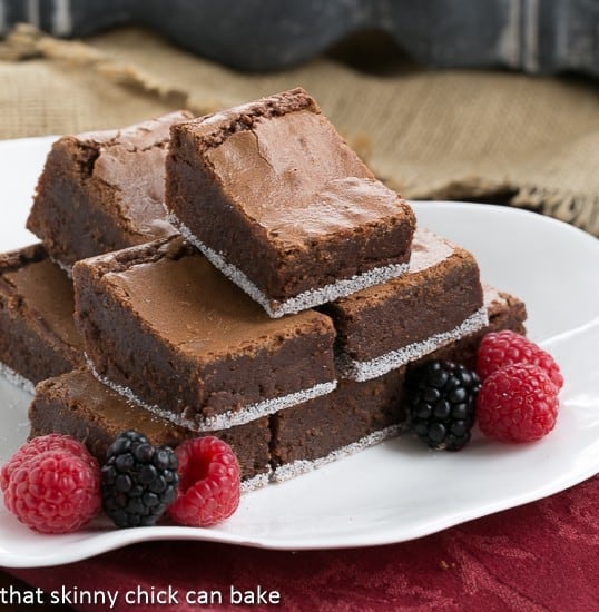 One Bowl Fudgy Brownies on a white serving tray with a berry garnish