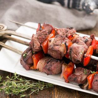 Greek Marinated Lamb Kebabs on a white serving tray