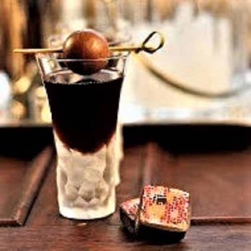 Frangelico Truffle Cocktail garnished with a chocolate truffle