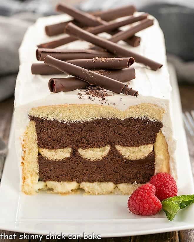 Layered Chocolate Mousse Cake with Ladyfingers---front view with first slice removed