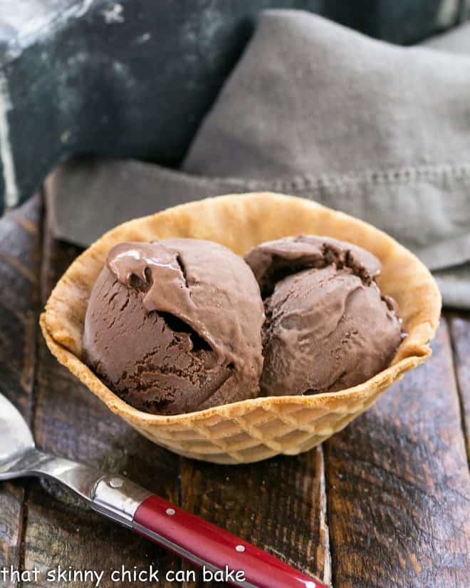 Chocolate Velvet ice cream in a waffle bowl with a red handled spoon