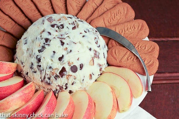 Chocolate Chip Cookie Dough Dip on a white plate with apple slices and cookies