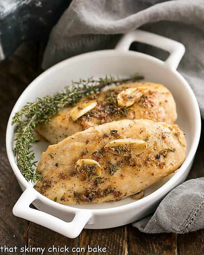 Maple Mustard Glazed Chicken Breasts in a white dish with handles