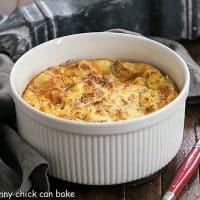 Cheese Souffle AKA Omelet i a souffle dish with a red handle spoon