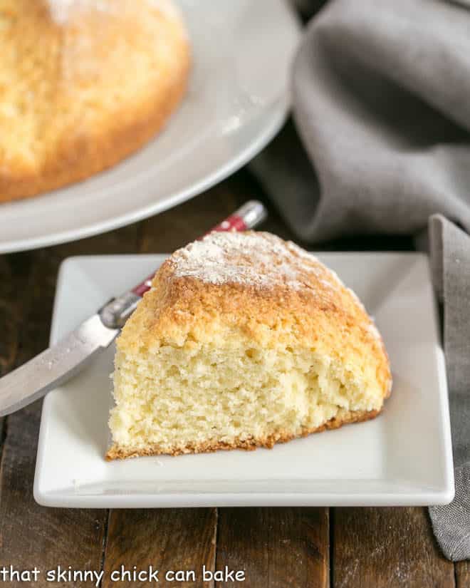 Irish soda bread slice on a white ceramic plate