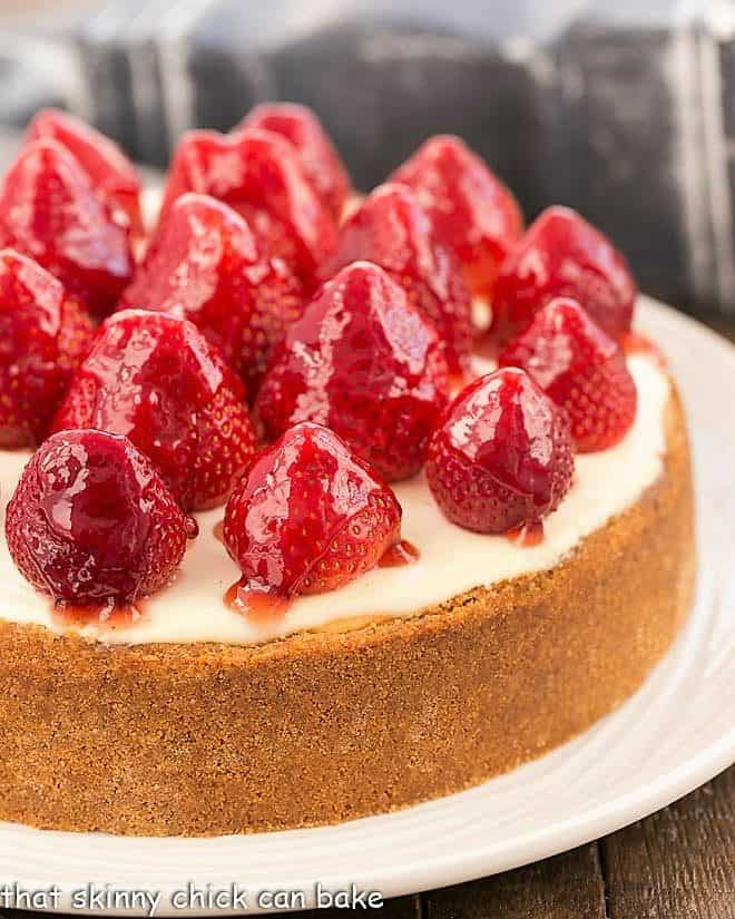 Strawberry Topped Cheesecake on white serving plate