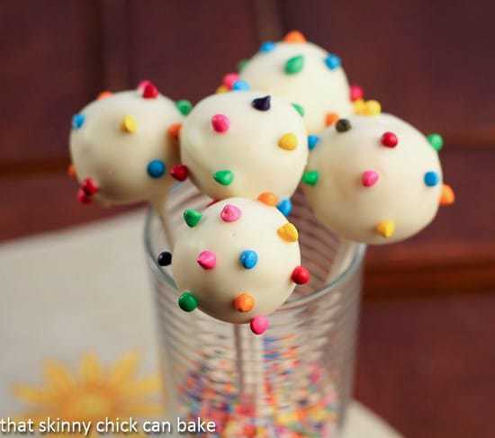 Close view of Cheesecake Pops inn a glass full of sprinkles