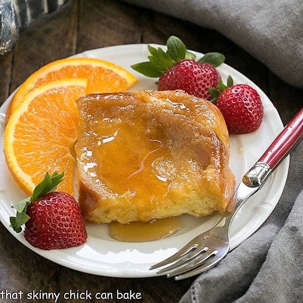 Creme Brulee French toast topped with syrup on a small white plate.