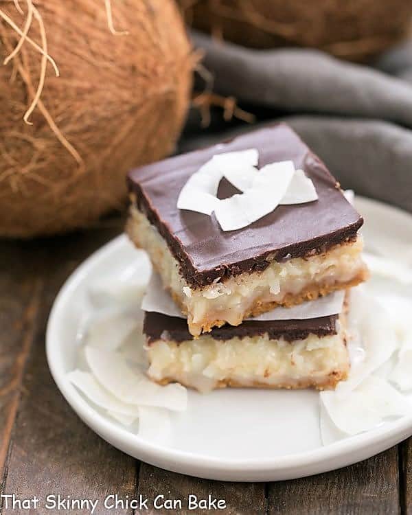 Mounds Bars stacked on a round white plate.