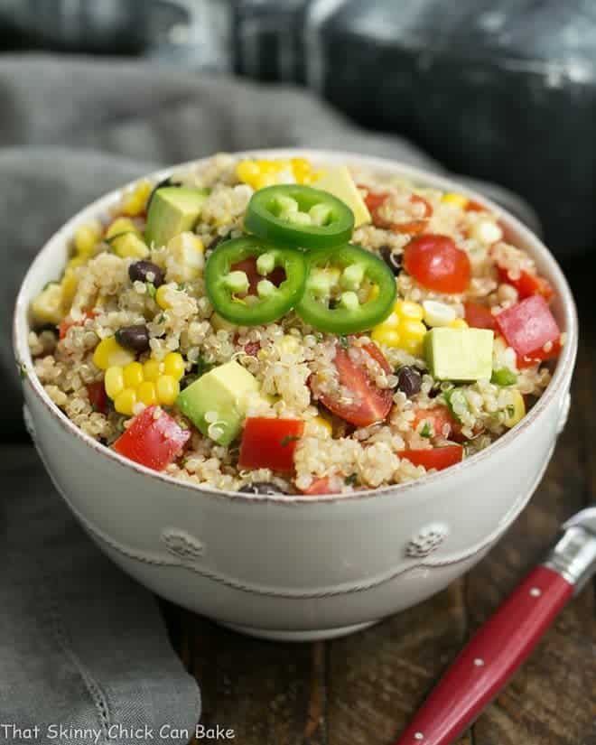 Quinoa Black Bean Salad with Lime Cumin Vinaigrette in a white ceramic bowl