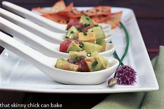 Tuna tartare in Asian Spoons on a white tray.