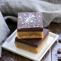 Caramel Espresso Bars stacked on a square white plate