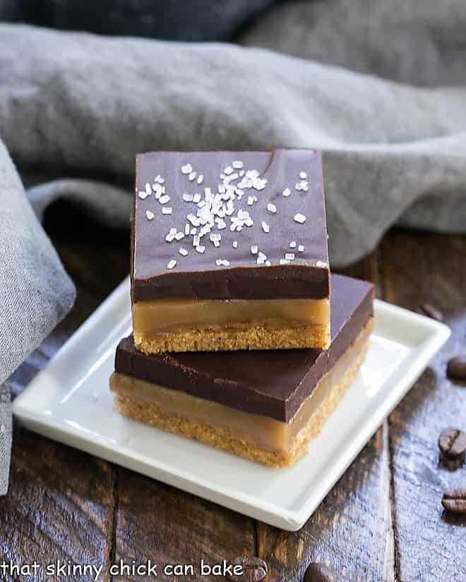 Caramel Espresso Bars stacked on a square white plate.
