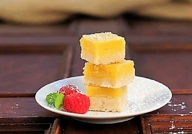 Meyer Lemon Bars stacked on a white plate