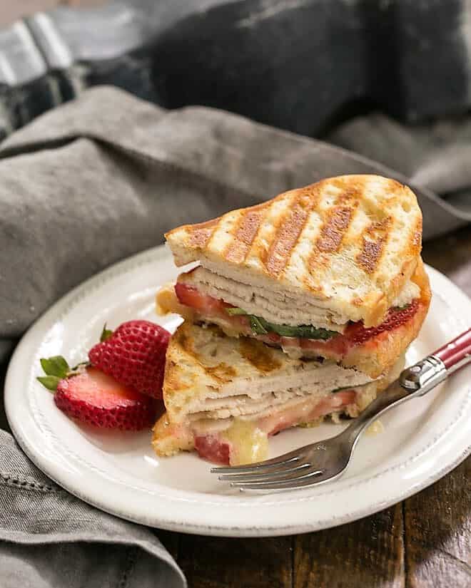 Side view of a stacked Strawberry, Turkey and Brie Grilled Cheese.