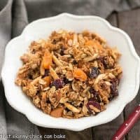 Overhead view of a white bowl filled with vanilla granola