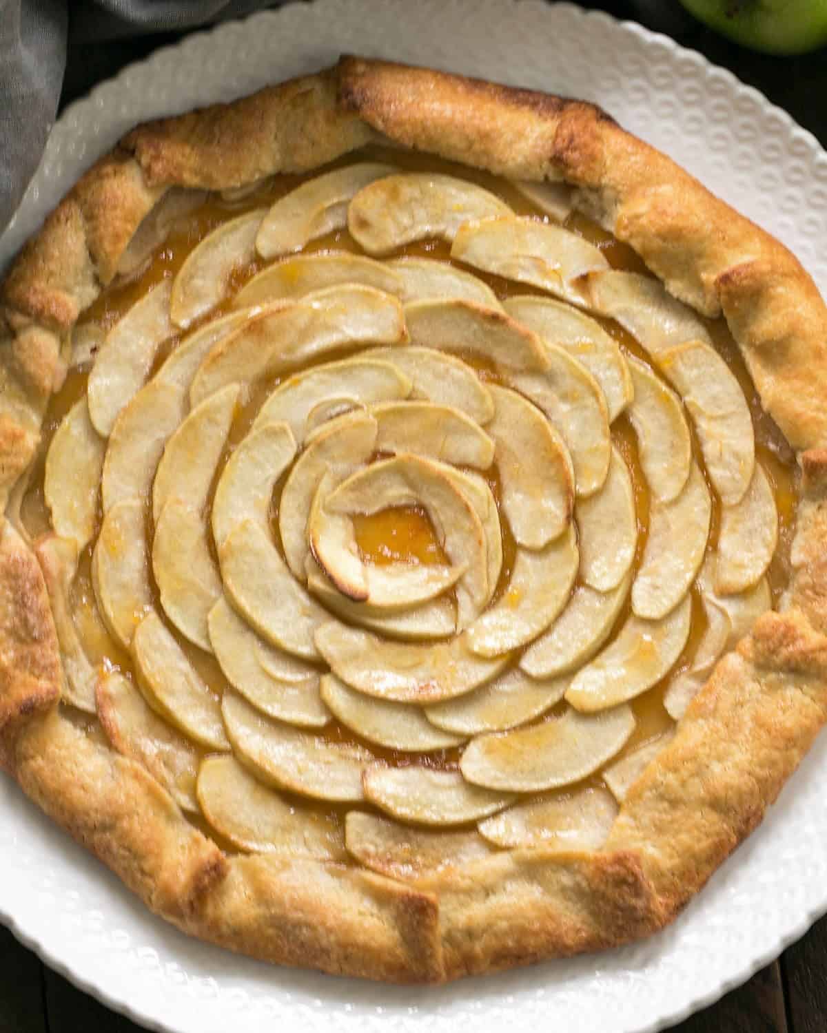 Overhead view of Apple crostata on a white serving plate