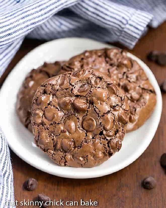  3 Flourless Chocolate Cookies on a small white plate.