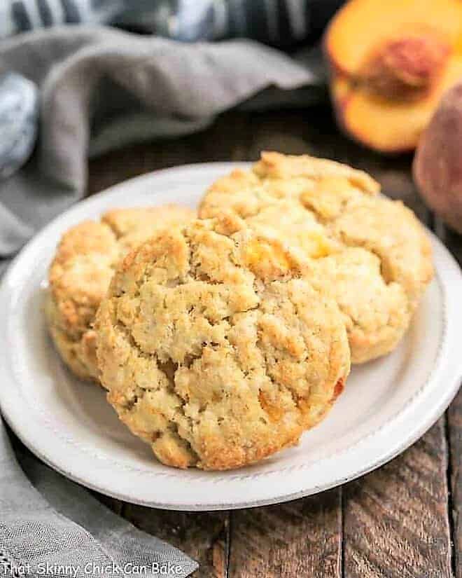 Brown Butter Peach Scones on a round white plate.