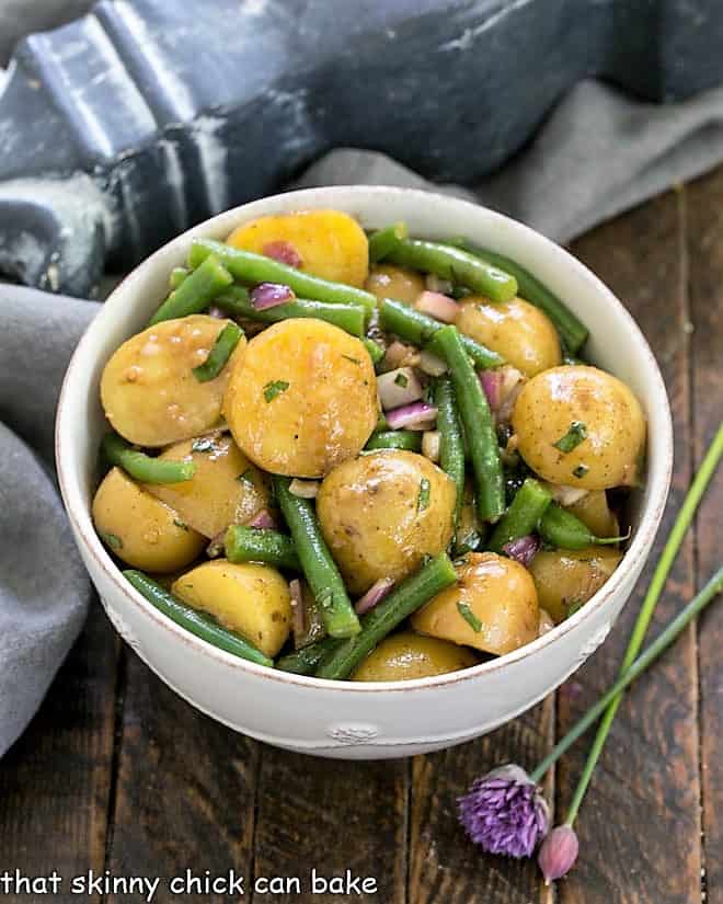 Potato and Green Bean Salad with Dijon Vinaigrette in a white serving bowl.