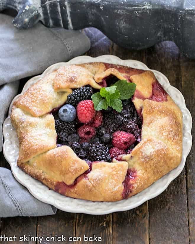 Overhead view of Mixed Berry Galette on a white serving plate.