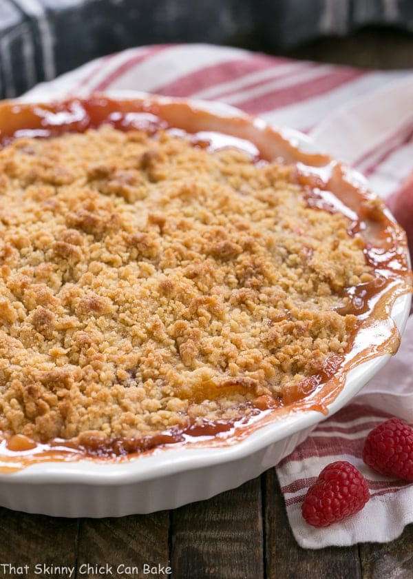 Peach Raspberry Crisp in a white porcelain pie plate.