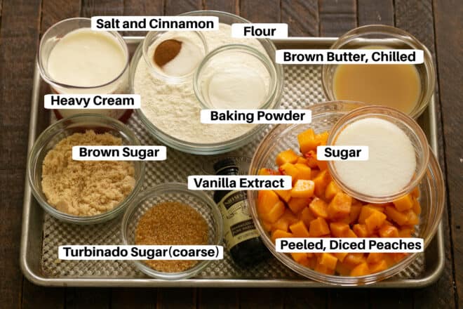 Peach scones ingredients with labels on a sheetpan.