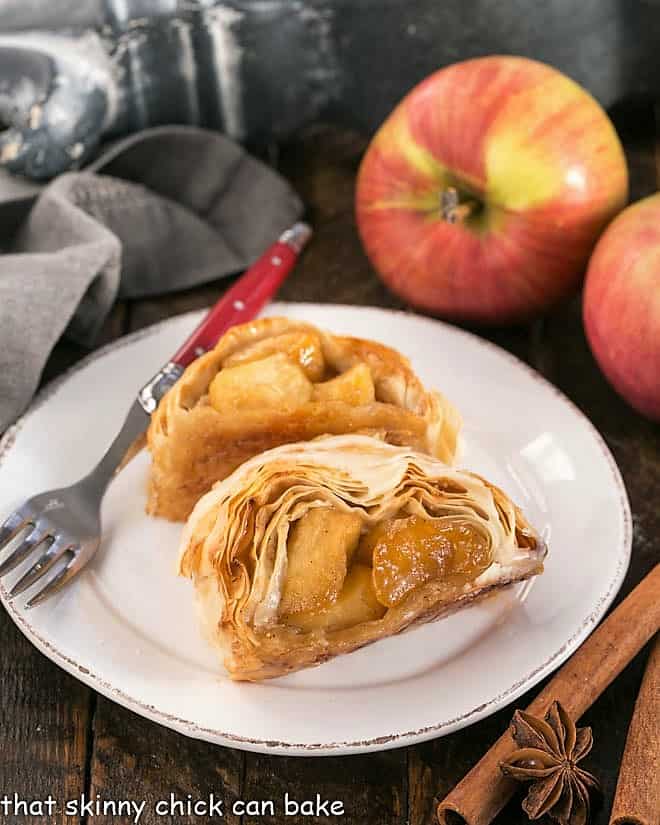 Two slices of strudel on a round white plate