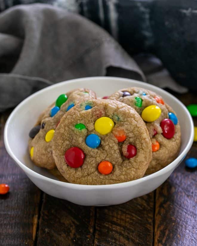 Small white  bowl of M&M Cookies