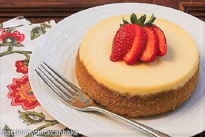 Crème Brûlée Cheesecake topped with a fanned strawberry