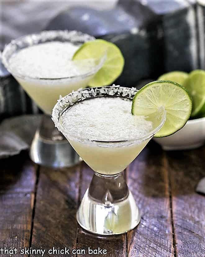 Easy 3-Ingredient Beer Margaritas in martini glasses with lime garnishes