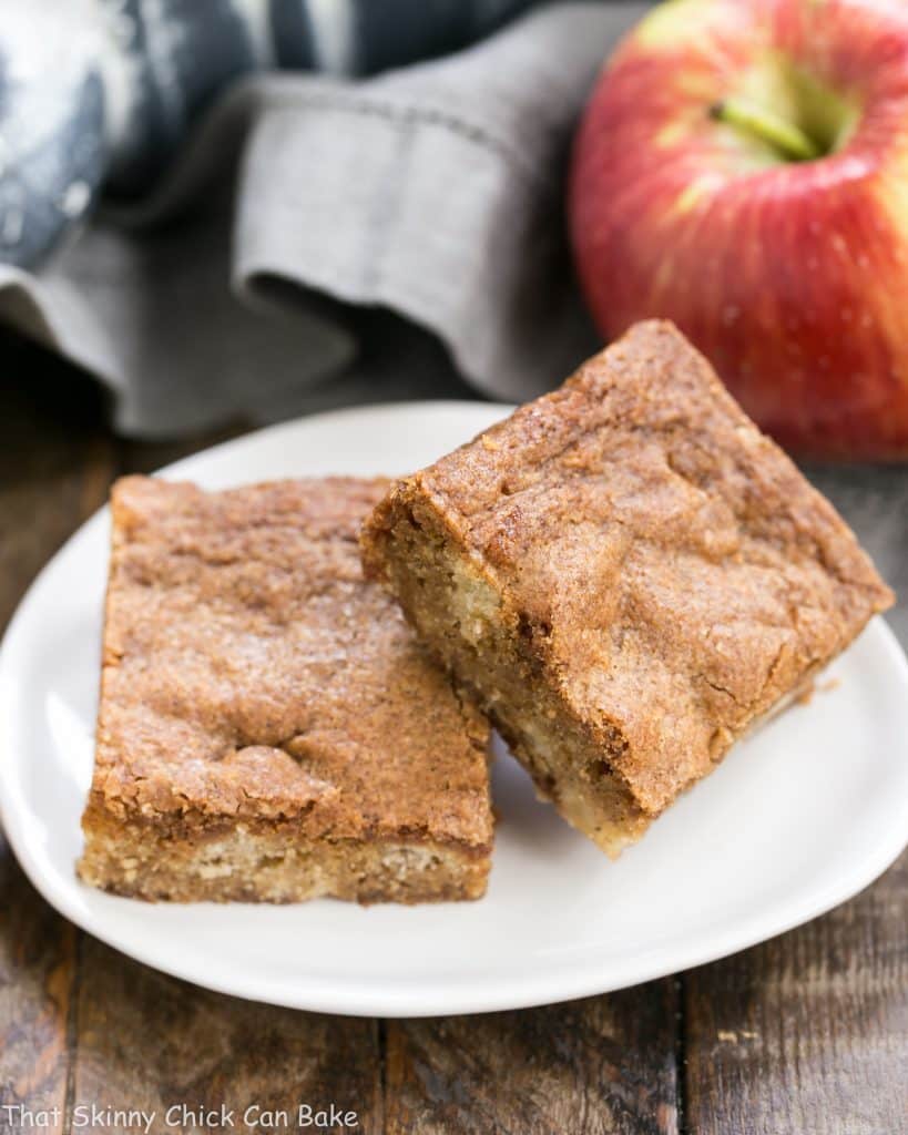 Apple Brownies on a white tear shaped ceramic plate