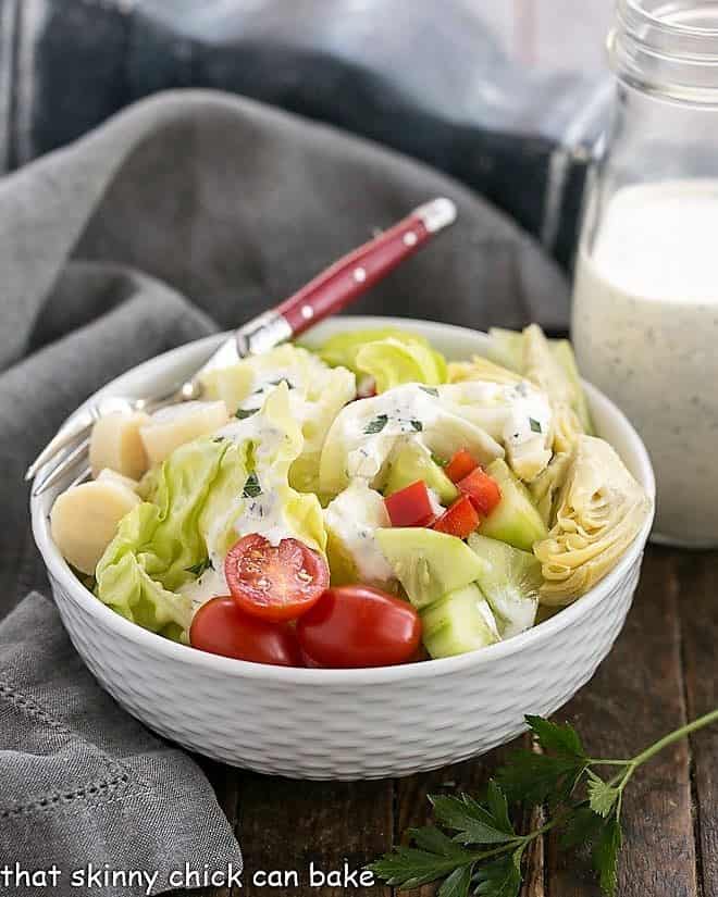 The Ultimate Ranch Dressing in white ceramic bowl with a red handled fork