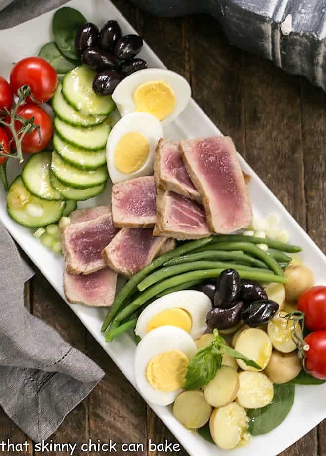 Overhead view of Ahi Tuna Salade Niçoise on a white platter.