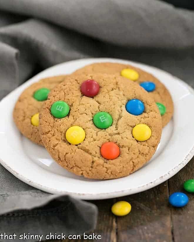 Classic M & M Cookies on a round white plate