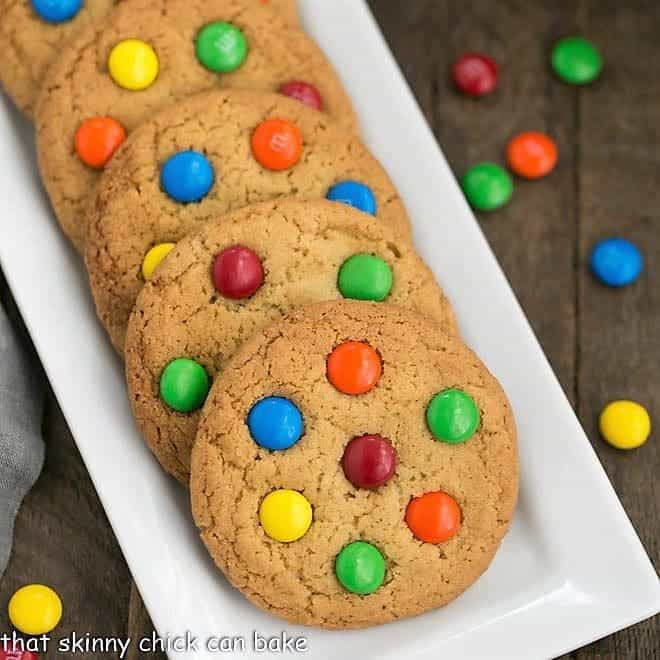 Classic M & M Cookies on a white ceramic tray