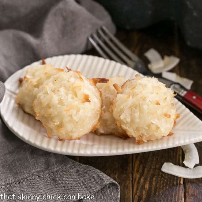Coconut Macaroons on a leaf shaped white plate.