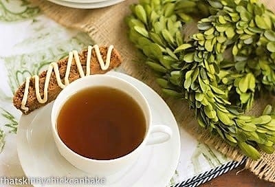 Gingerbread Biscotti on a saucer with a cup of tea