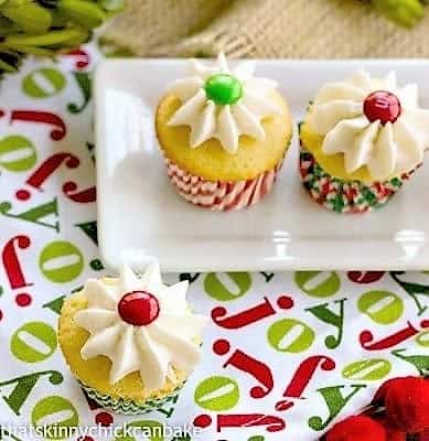Holly Topped White Cupcakes topeed with frosting and M&Ms